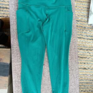 Athleta Salutation Stash 7/8 Leggings - size small teal green